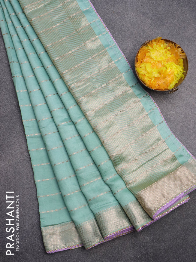 Semi chanderi saree pastel green shade and lavender with allover zari woven stripes pattern and zari woven & gotapatti lace work border