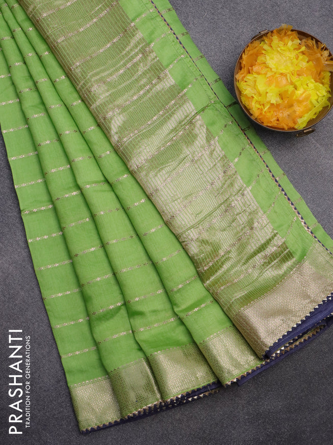 Semi chanderi saree light green and grey with allover zari woven stripes pattern and zari woven & gotapatti lace work border