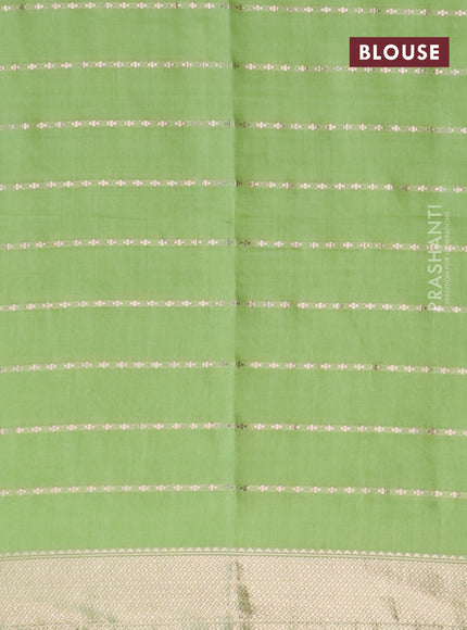 Semi chanderi saree light green and grey with allover zari woven stripes pattern and zari woven & gotapatti lace work border