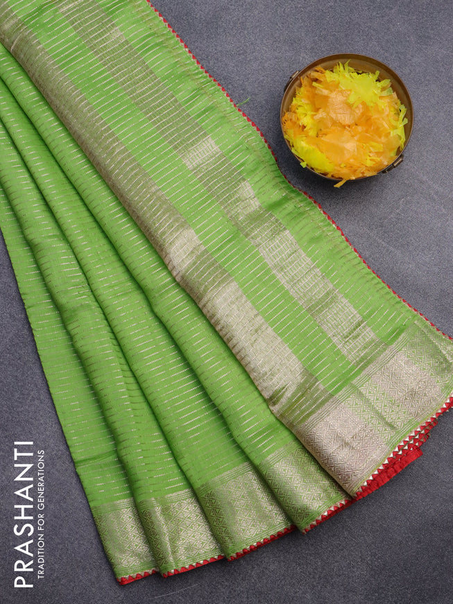 Semi chanderi saree light green and red with allover zari weaves and zari woven & gotapatti lace work border