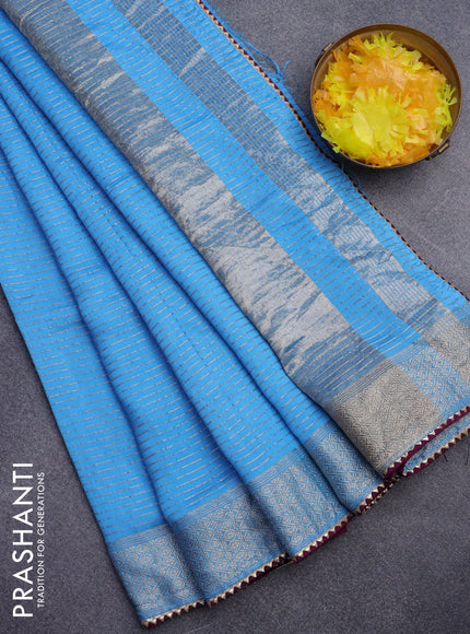 Semi chanderi saree light blue and purple with allover zari weaves and zari woven & gotapatti lace work border