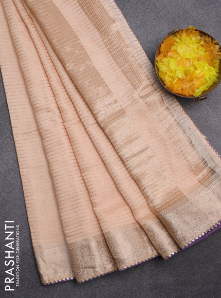 Semi chanderi saree sandal and lavender shade with allover zari weaves and zari woven & gotapatti lace work border