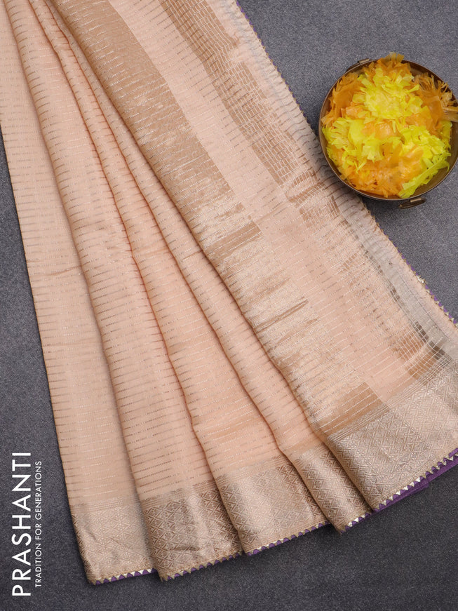 Semi chanderi saree sandal and lavender shade with allover zari weaves and zari woven & gotapatti lace work border