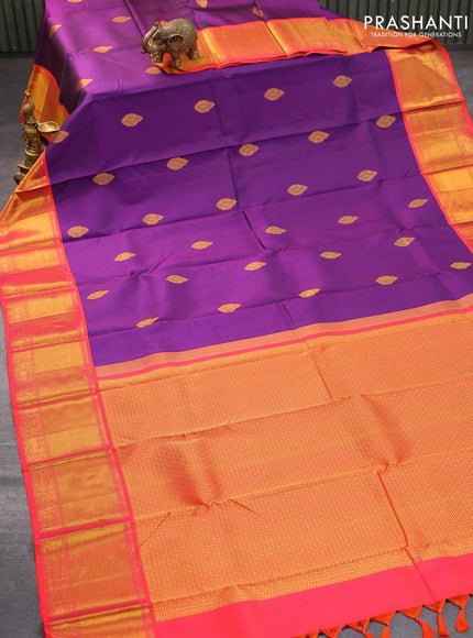 Pure kanjivaram silk saree dark blue and dual shade of pinkish orange with allover self emboss & zari buttas and rich zari woven border