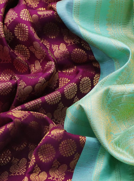 Pure kanjivaram silk saree deep purple and teal blue shade with allover annam zari woven butta weaves and rich zari woven border