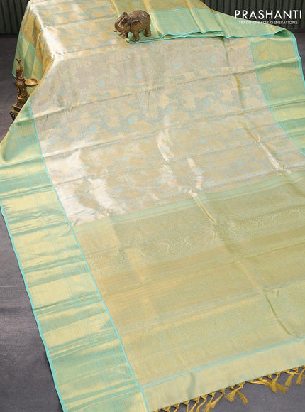 Pure kanjivaram tissue silk saree cream and teal blue with allover zari woven brocade weaves and zari woven border