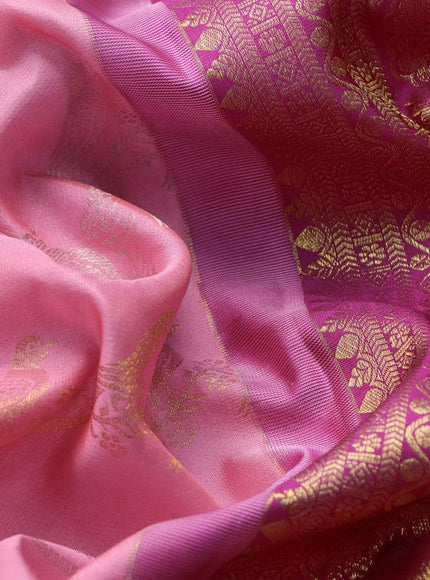 Pure kanjivaram silk saree light pink and pink with allover zari weaves and long zari woven border