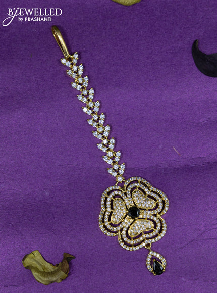 Zircon maang tikka with black & cz stones and hangings in gold finish