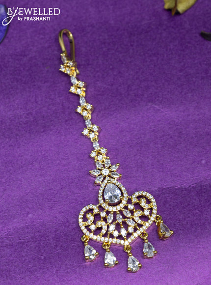 Zircon maang tikka with cz stones and hangings in gold finish