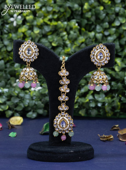 Kundan necklace with mint green & pink beads hanging and maang tikka