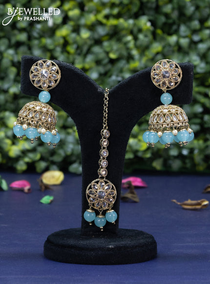 Kundan necklace with ice blue beads hanging and maang tikka