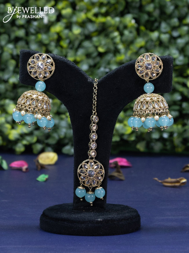 Kundan necklace with ice blue beads hanging and maang tikka