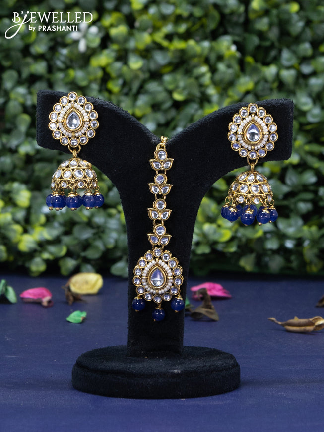 Kundan necklace with navy blue beads hanging and maang tikka