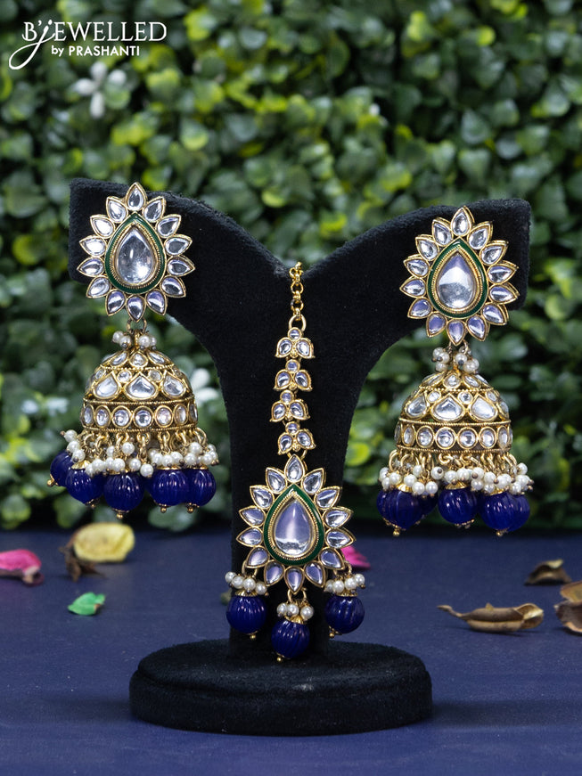 Kundan necklace with blue beads hanging and maang tikka