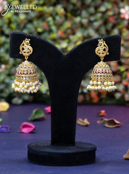 Antique jhumka peacock design with pink kemp & cz stones and pearl hangings