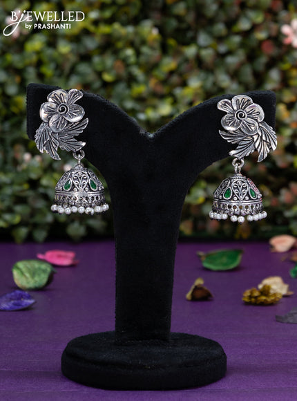 Oxidised jhumka floral design with emerald stones and pearl hangings