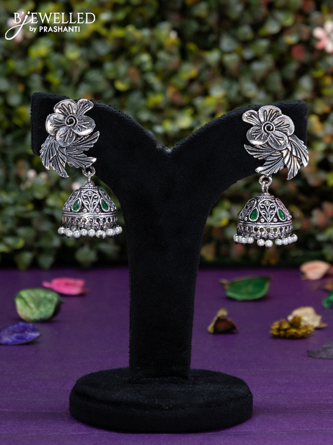 Oxidised jhumka floral design with emerald stones and pearl hangings