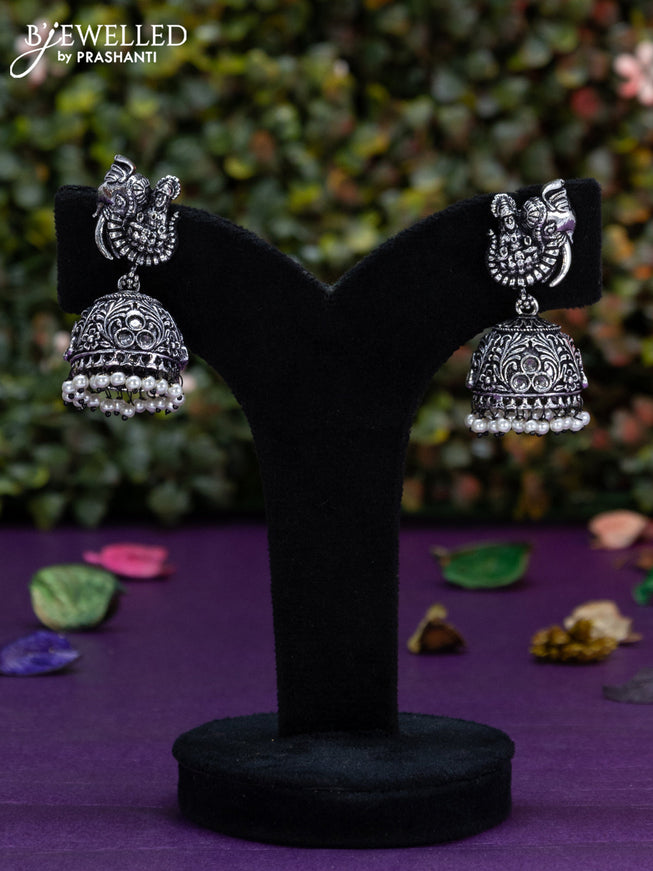 Oxidised jhumka lakshmi design with cz stones and pearl hangings