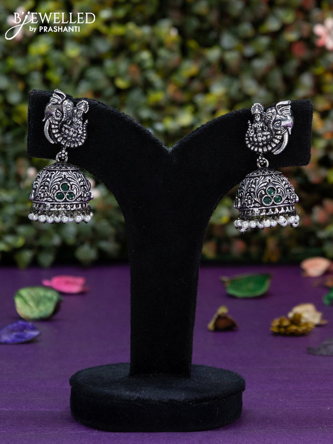 Oxidised jhumka lakshmi design with emerald stones and pearl hangings