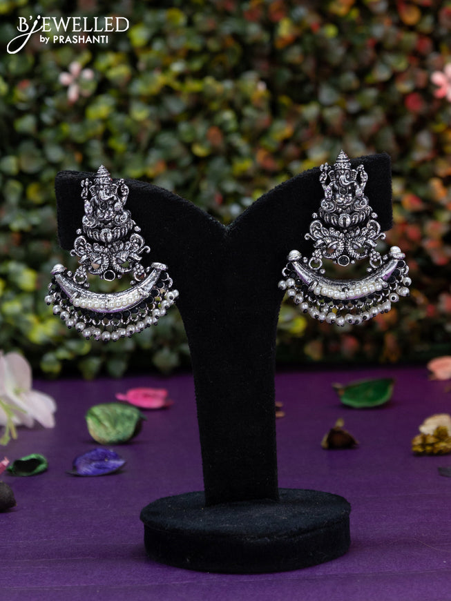 Oxidised earring ganesha design with black stone and pearl hangings