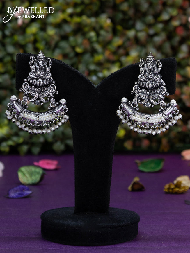 Oxidised earring ganesha design with cz stones and pearl hangings