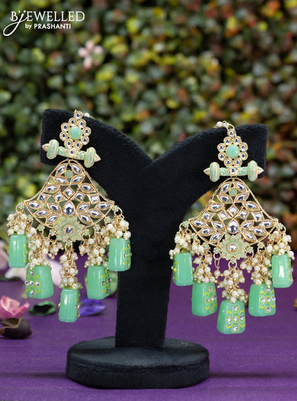 Fashion dangler minakari teal green earrings with kundan stones and beads hangings