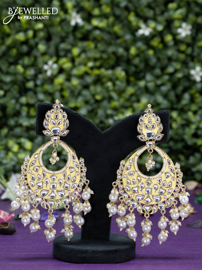 Fashion dangler yellow earrings with kundan stones and beads hangings