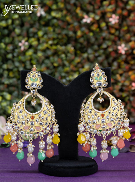 Fashion dangler cream earrings with kundan stones and multi colour beads hangings