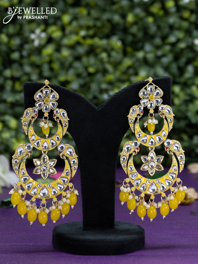 Fashion dangler yellow earrings with kundan stones and beads hangings