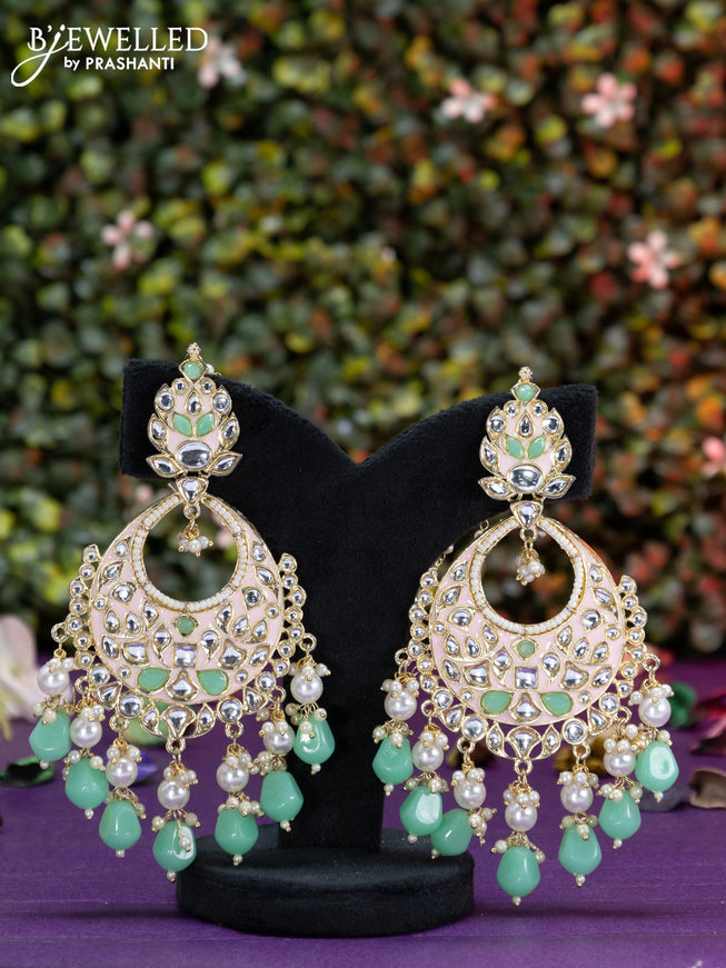 Fashion dangler light green earrings with kundan stones and beads hangings