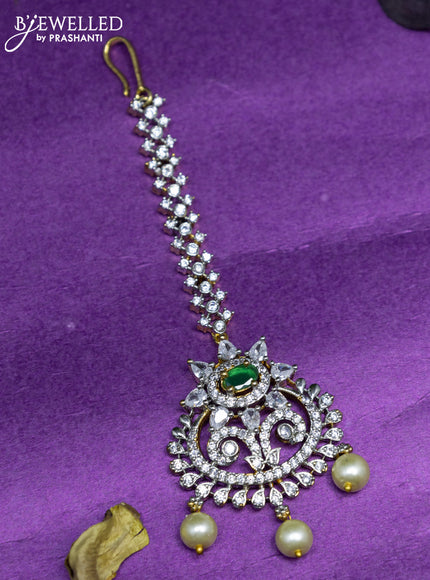 Zircon maang tikka with emerald & cz stones and pearl hangings in gold finish