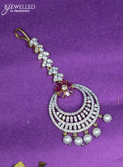 Zircon maang tikka with ruby & cz stones and hangings in gold finish