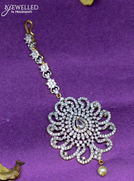 Zircon maang tikka with cz stones and pearl hanging in gold finish