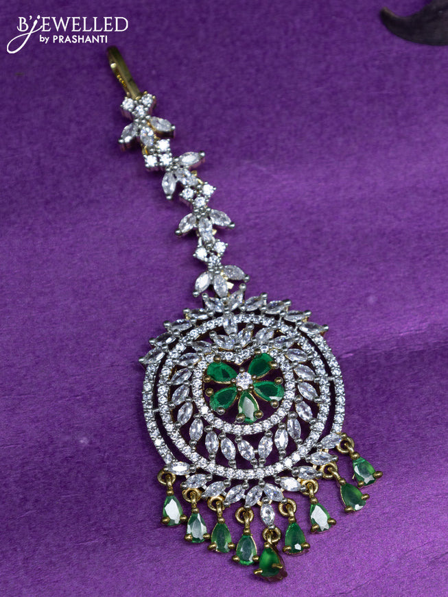 Zircon maang tikka with emerald & cz stones and pearl hangings in gold finish