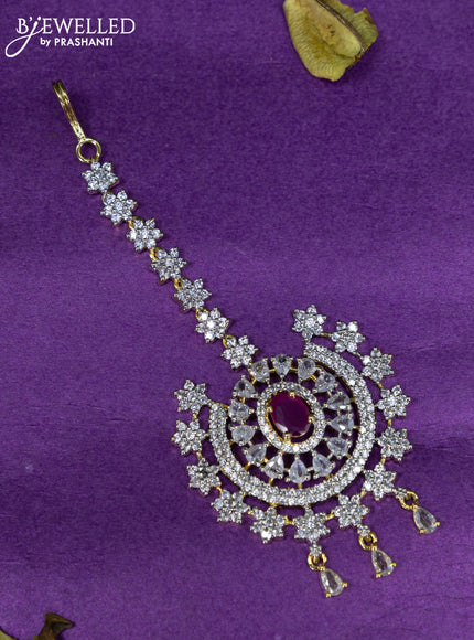 Zircon maang tikka with ruby & cz stones and hangings in gold finish