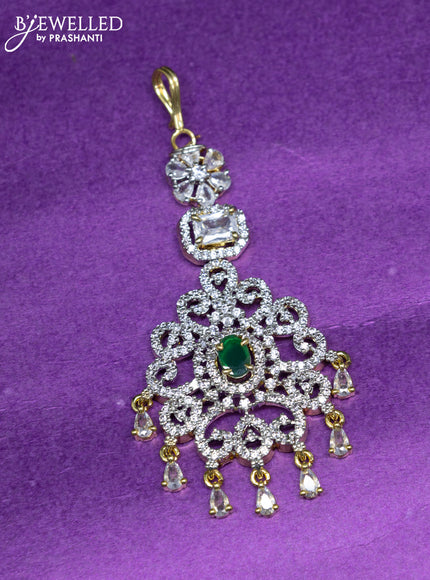 Zircon maang tikka with emerald & cz stones and hangings in gold finish