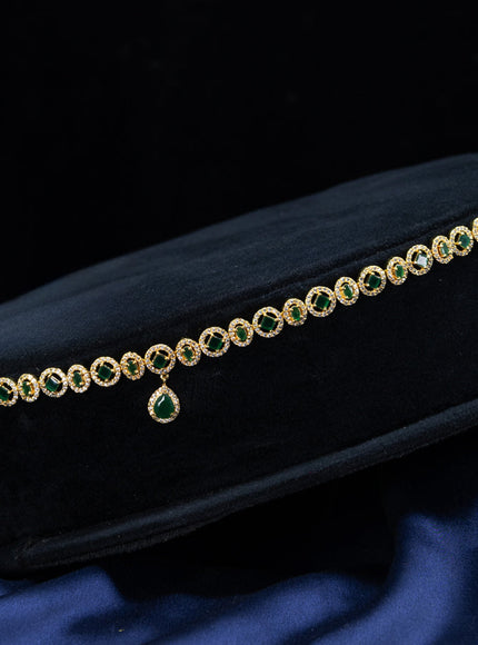 Zircon hip chain with emerald & cz stones and hanging in gold finish