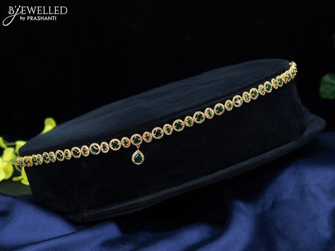 Zircon hip chain with emerald & cz stones and hanging in gold finish