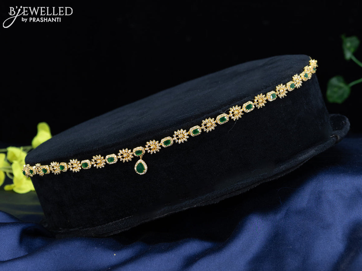 Zircon hip chain with emerald & cz stones and hanging in gold finish