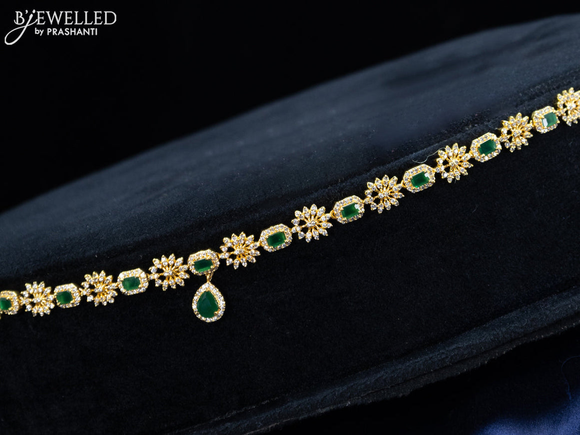 Zircon hip chain with emerald & cz stones and hanging in gold finish