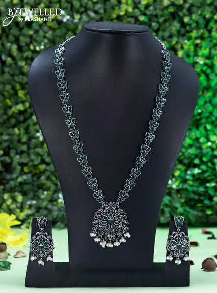 Oxidised necklace peacock design with emerald stones and pearl hangings