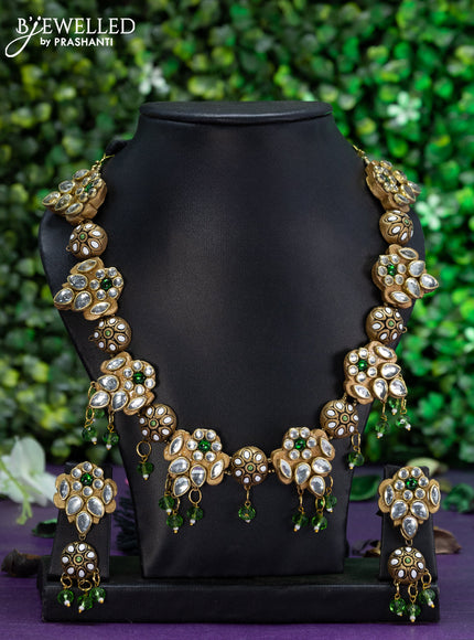 Teracotta necklace with kundan stones and beads hangings