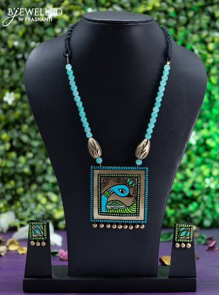 Teracotta teal green beaded necklace with peacock pendant