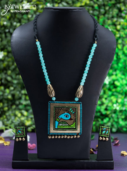 Teracotta teal green beaded necklace with peacock pendant