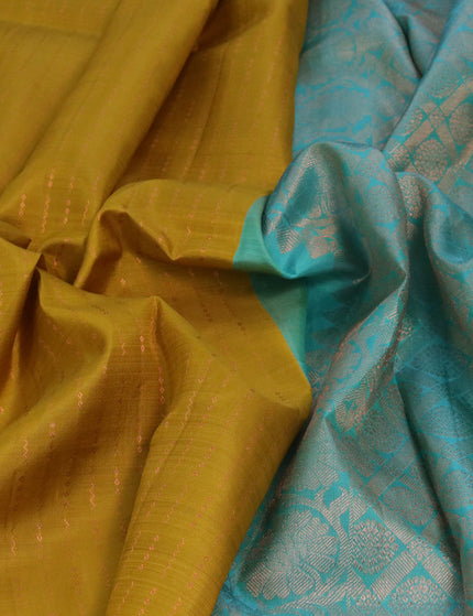 Pure kanjivaram silk saree mustard yellow and teal blue with allover copper zari weaves in borderless style