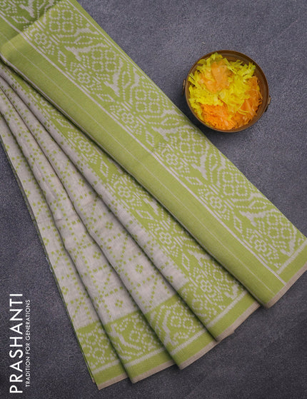 Munga cotton saree beige and light green with allover thread weaves and thread woven border