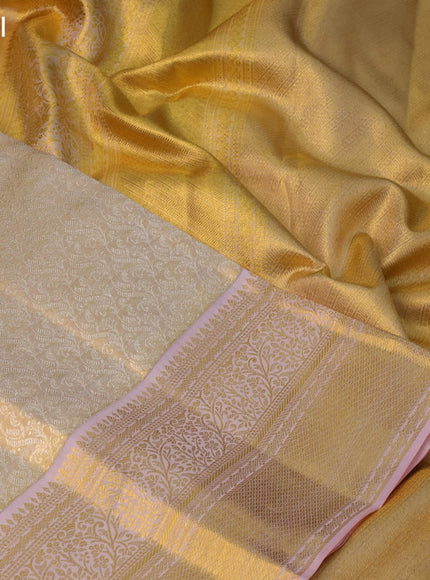 Pure kanchipuram tissue silk saree gold and peach pink with allover silver zari woven butta weaves and zari woven border