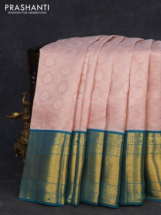 Pure kanchipuram silk saree pastel pink and peacock green with allover silver zari woven brocade weaves and long zari woven border