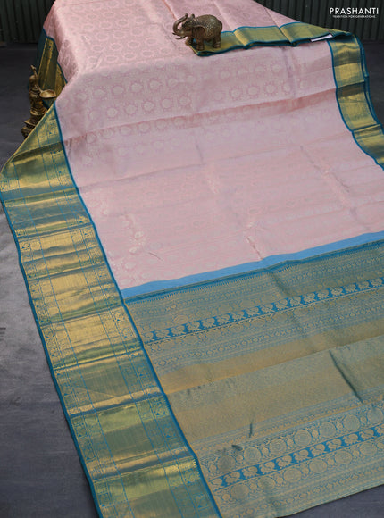 Pure kanchipuram silk saree pastel pink and peacock green with allover silver zari woven brocade weaves and long zari woven border