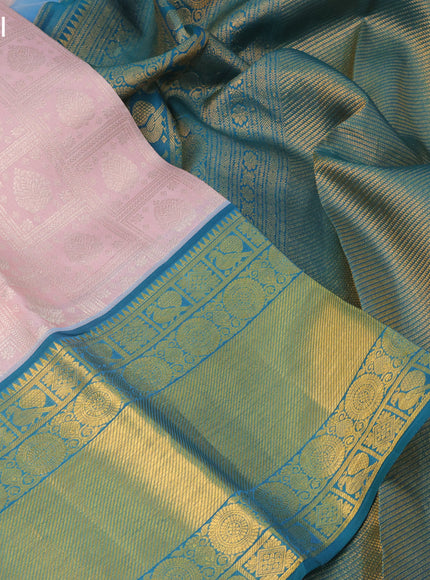 Pure kanchipuram silk saree pastel pink and peacock green with allover silver zari woven brocade weaves and long zari woven border